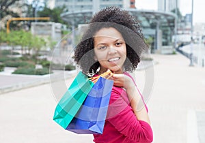 Beautiful african american woman with shopping bags
