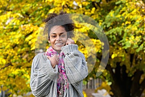 Beautiful african american woman smiling in autumn