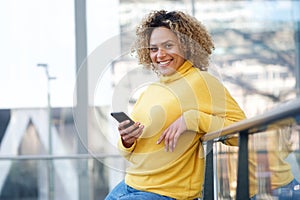 Beautiful african american woman smiling with cellphone