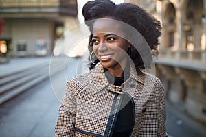 Beautiful African American woman, urban street portrait