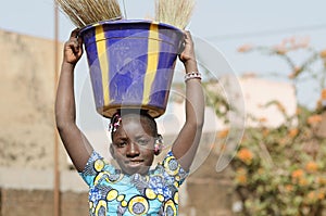 Beautiful African Child Helping Her Family - Child Labour Symbol