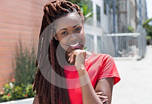 Beautiful african woman with dreadlocks in the city