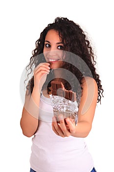 Beautiful african woman holding chocolate bar