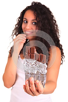 Beautiful african woman holding chocolate bar