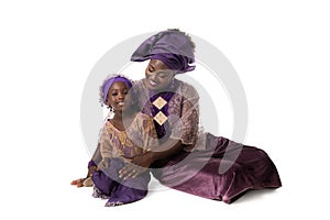 Beautiful African woman and lovely little girl in taditional dress.Isolated