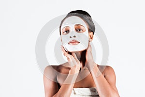 Beautiful African woman in Studio with facial mask