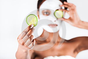 Beautiful African woman in Studio with facial mask