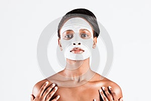 Beautiful African woman in Studio with facial mask