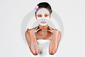 Beautiful African woman in Studio with facial mask