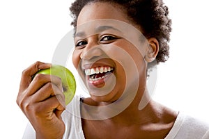 Beautiful African women eating an apple