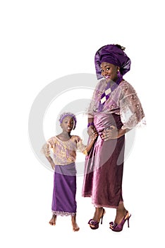 Beautiful African woman and lovely little girl in traditional clothing,isolated