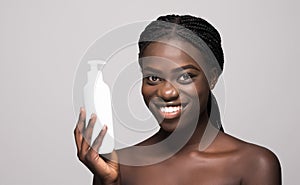 Beautiful african young woman face spray on face lotion cosmetology on white background