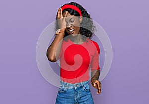 Beautiful african young woman wearing casual clothes yawning tired covering half face, eye and mouth with hand