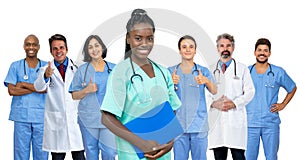 Beautiful afro american female nurse with doctor and medical team