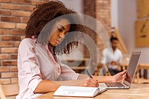 Beautiful Afro-American woman working