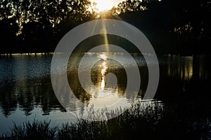 Beautiful afternoon sunlight with reflection in lake water