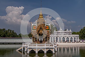 The beautiful Aisawan Dhiphya Asana pavilion inside the Royal Palace of Bang Pa In, Thailand, with reflection on the water