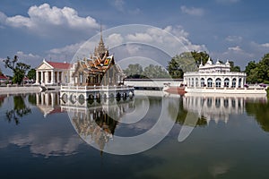 The beautiful Aisawan Dhiphya Asana pavilion and the Royal Palace of Bang Pa In, Thailand, with reflection on the water