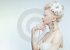 Beautiful albino girl with red lips on white background