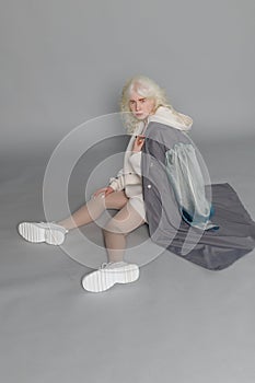 Beautiful albino girl with white skin, natural lips and white hair