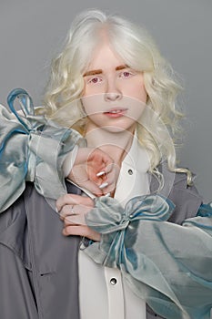 Beautiful albino girl with white skin, natural lips and white hair