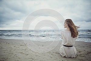 Beautiful alone girl on the beach