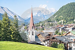 Alpine landscape with Pfarrkirche, Seefeld, Austria photo