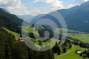 Beautiful alpine landscape with green meadows, alpine cottages and mountain peaks, Lechtal, Lech, Austria