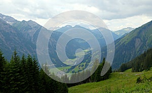 Beautiful alpine landscape with green meadows, alpine cottages and mountain peaks, Lechtal, Lech, Austria