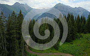 Beautiful alpine landscape with green meadows, alpine cottages and mountain peaks, Lechtal, Lech, Austria