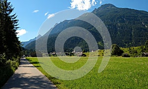 Beautiful alpine landscape with green meadows, alpine cottages and mountain peaks, Lechtal, Lech, Austria