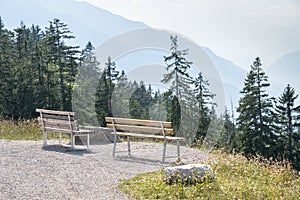 Beautiful alpine landscape with two benchs