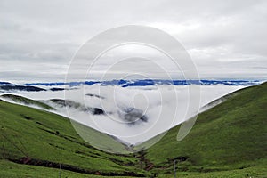 Beautiful alpine meadows, clouds and mists in the mountains, like fairyland