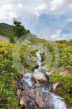 Beautiful alpine scenery with waterfall, waterfall in Alps