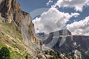 Beautiful Alps with rocky mountain and green hill