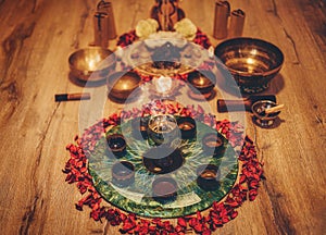 Beautiful altar with rose petals and incense. Cacao ceremony space.