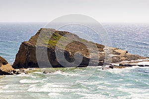 Beautiful Alteirinhos Beach and rock formation next to Zambujeira do Mar, Portugal photo