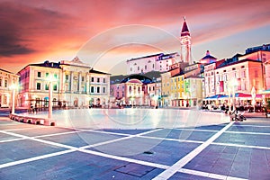 Beautiful amazing city scenery in the central square with the old clock tower in Piran, the tourist center of Slovenia in the