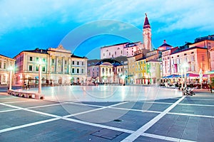 Beautiful amazing city scenery in the central square with the old clock tower in Piran, the tourist center of Slovenia in the