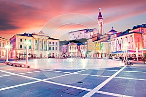 Beautiful amazing city scenery in the central square with the old clock tower in Piran, the tourist center of Slovenia in the