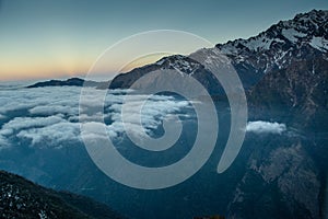 Beautiful amazing sunrise landscape with floating clouds at the mountains in Himalayas