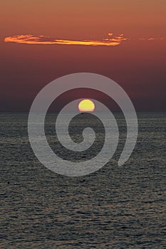 Beautiful amazing sunset on the Ionian Sea is unique, the beach of San Gregorio in Puglia in Italy