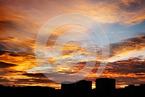 beautiful amazing view at sun rising over city buildings in summer