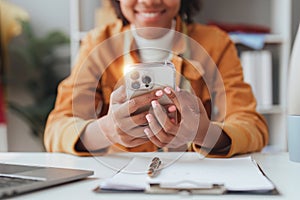 Beautiful American African woman completes KYC using an online banking program in order to open a digital savings