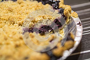 Beautiful American style blueberry pie with one slice missing