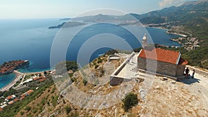 Beautiful ancient Sveti Savva church overlooking the coastline and the Sveti Stefan island