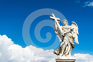 Beautiful angel with Cross in the Bridge of Saint Angelo Castle, Rome