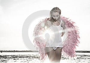 Beautiful angel woman with pink wings