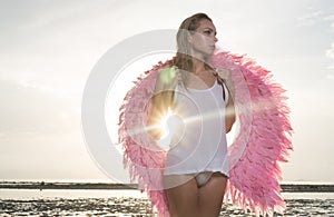 Beautiful angel woman with pink wings