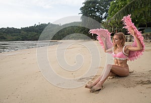 Beautiful angel woman with pink wings